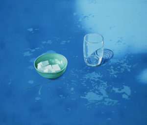 Stillife with glass on a blue table